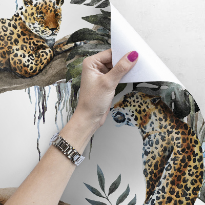 Bildtapete Leopard auf einem Baum ruhend