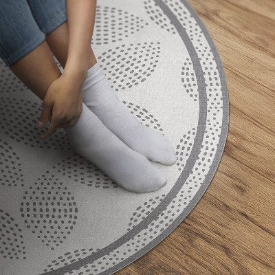 Runder pvc teppich Komposition aus dunklen Blättern mit Punkten