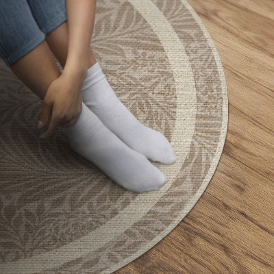 Runder teppich auf pvc Blätter und Zweige im Boho-Stil