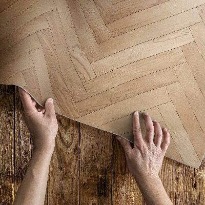 Teppich pvc Elegantes Fischgrätenparkett aus hellem Holz