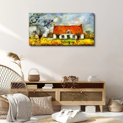 Leinwandbild Ein farbenfrohes Landhaus in der Landschaft