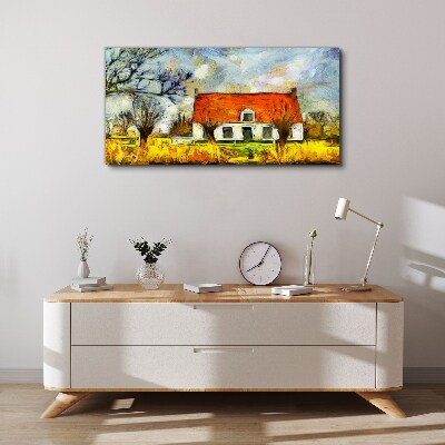 Leinwandbild Ein farbenfrohes Landhaus in der Landschaft