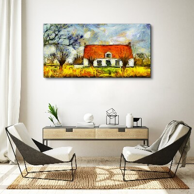 Leinwandbild Ein farbenfrohes Landhaus in der Landschaft