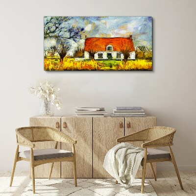 Leinwandbild Ein farbenfrohes Landhaus in der Landschaft