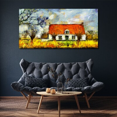 Leinwandbild Ein farbenfrohes Landhaus in der Landschaft