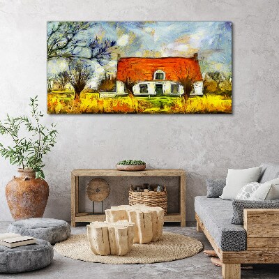 Leinwandbild Ein farbenfrohes Landhaus in der Landschaft