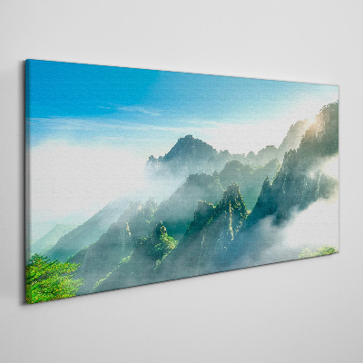 Foto auf leinwand Berglandschaft an einem nebligen Morgen