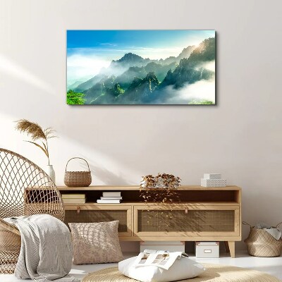 Foto auf leinwand Berglandschaft an einem nebligen Morgen