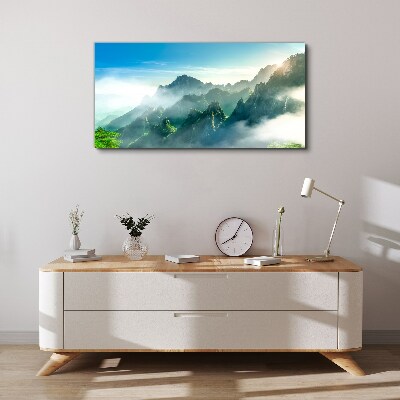 Foto auf leinwand Berglandschaft an einem nebligen Morgen