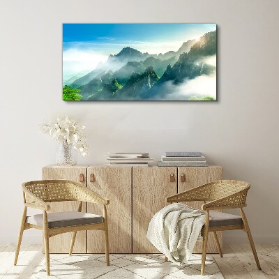 Foto auf leinwand Berglandschaft an einem nebligen Morgen