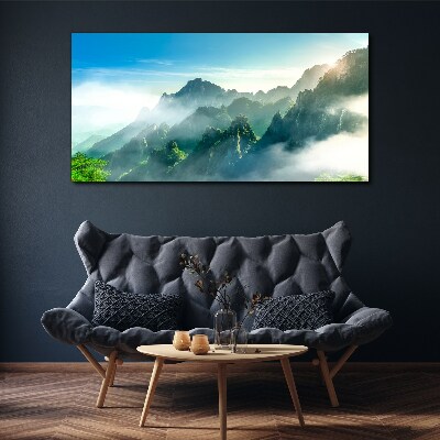 Foto auf leinwand Berglandschaft an einem nebligen Morgen