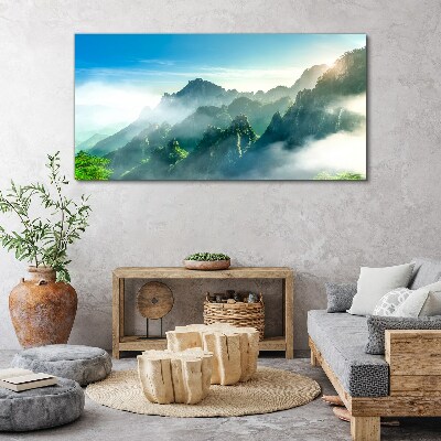 Foto auf leinwand Berglandschaft an einem nebligen Morgen