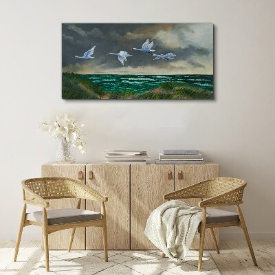 Bild auf leinwand Flug der Schwäne über dem Meer