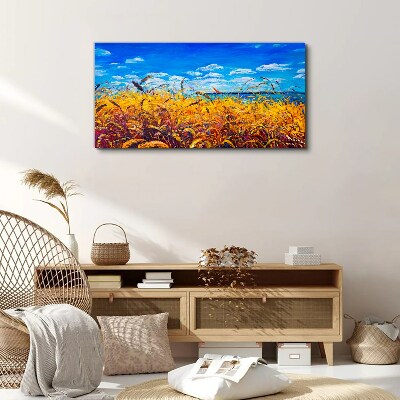 Foto auf leinwand Goldene Felder unter blauem Himmel