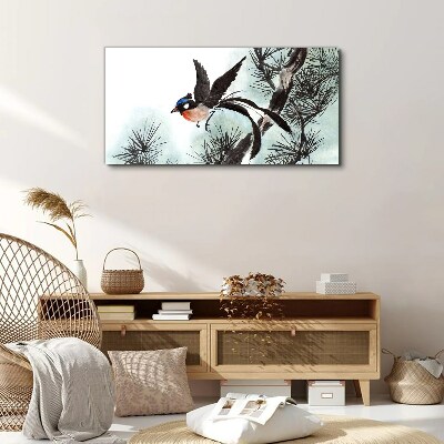 Foto auf leinwand Ein Vogel im Flug über den Kiefern