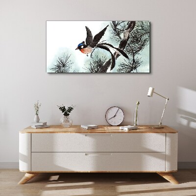 Foto auf leinwand Ein Vogel im Flug über den Kiefern
