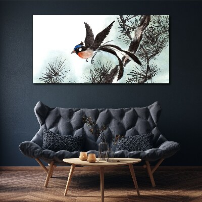 Foto auf leinwand Ein Vogel im Flug über den Kiefern