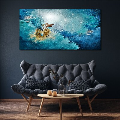Foto auf leinwand Ein eingesperrter Vogel gegen den Himmel