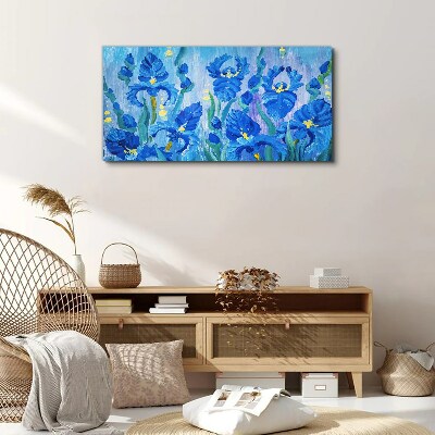 Foto auf leinwand Blaue Schwertlilien vor blauem Hintergrund