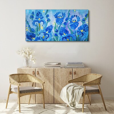 Foto auf leinwand Blaue Schwertlilien vor blauem Hintergrund