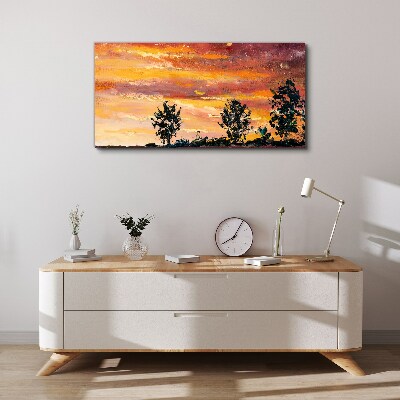 Foto auf leinwand Sonnenuntergang über den Bäumen