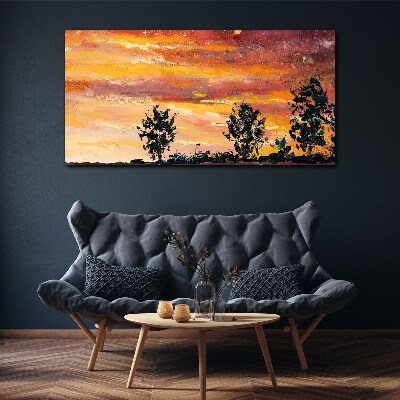 Foto auf leinwand Sonnenuntergang über den Bäumen