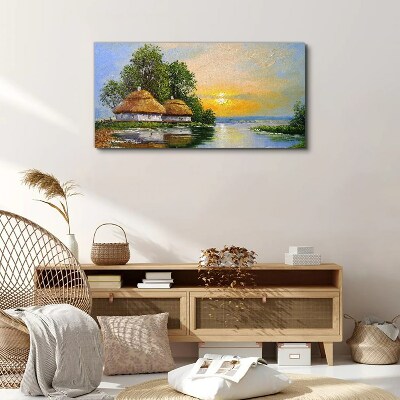 Foto auf leinwand Ein friedlicher Sonnenuntergang über dem Dorf