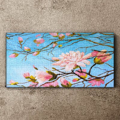 Foto auf leinwand Magnolienblüten auf blauem Hintergrund