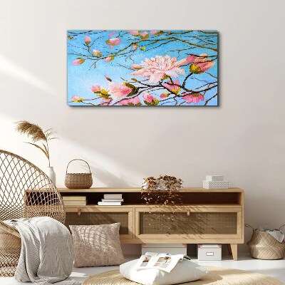 Foto auf leinwand Magnolienblüten auf blauem Hintergrund