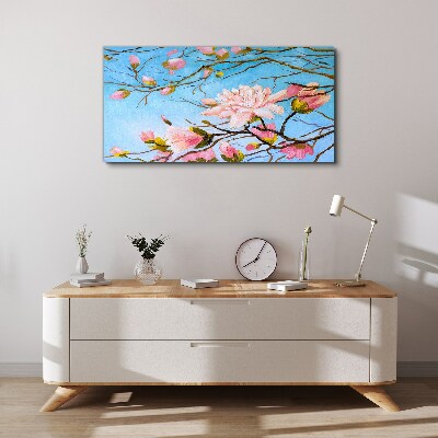 Foto auf leinwand Magnolienblüten auf blauem Hintergrund