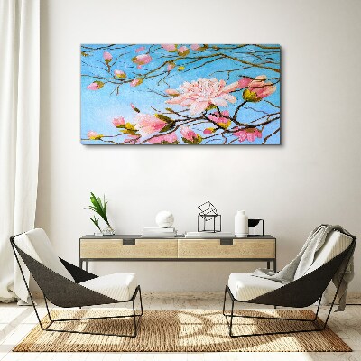 Foto auf leinwand Magnolienblüten auf blauem Hintergrund
