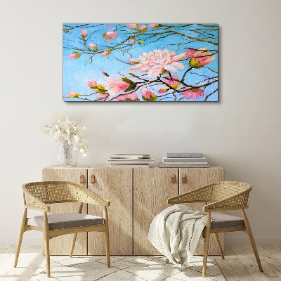 Foto auf leinwand Magnolienblüten auf blauem Hintergrund