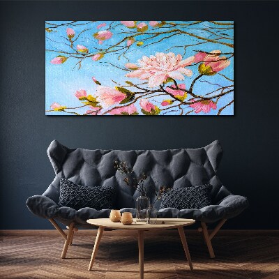 Foto auf leinwand Magnolienblüten auf blauem Hintergrund
