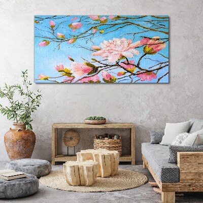 Foto auf leinwand Magnolienblüten auf blauem Hintergrund
