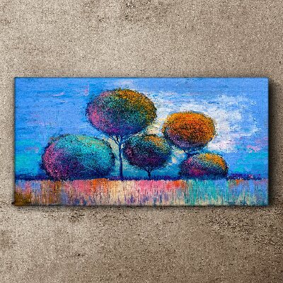 Foto auf leinwand Bunte Bäume auf blauem Hintergrund