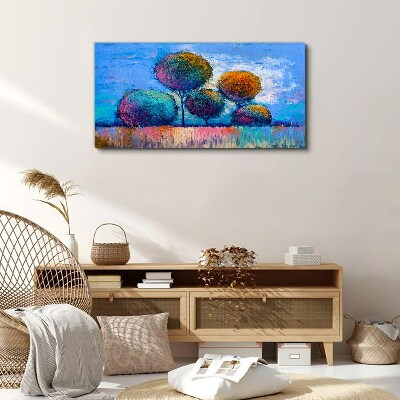 Foto auf leinwand Bunte Bäume auf blauem Hintergrund