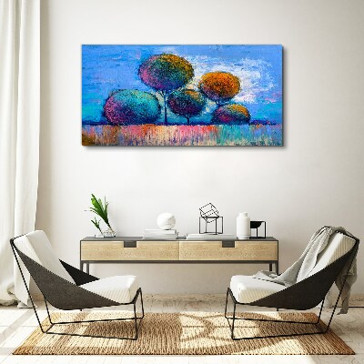 Foto auf leinwand Bunte Bäume auf blauem Hintergrund