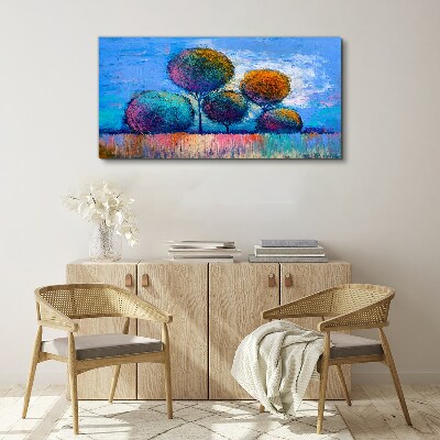 Foto auf leinwand Bunte Bäume auf blauem Hintergrund