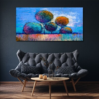 Foto auf leinwand Bunte Bäume auf blauem Hintergrund