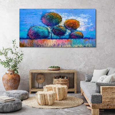 Foto auf leinwand Bunte Bäume auf blauem Hintergrund