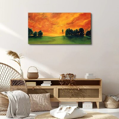 Foto auf leinwand Sonnenuntergang über dem grünen Hügel