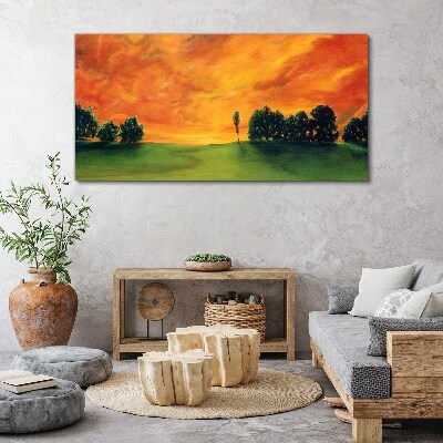 Foto auf leinwand Sonnenuntergang über dem grünen Hügel