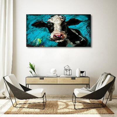 Foto auf leinwand Porträt einer Kuh auf blauem Hintergrund