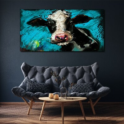 Foto auf leinwand Porträt einer Kuh auf blauem Hintergrund