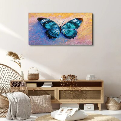 Foto auf leinwand Blauer Schmetterling auf pastellfarbenem Hintergrund