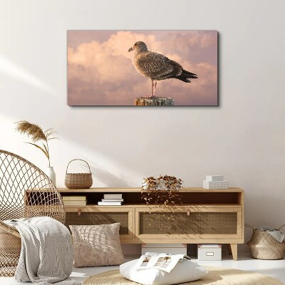 Foto auf leinwand Geflügelter Wächter in den Wolken