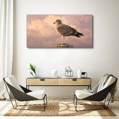 Foto auf leinwand Geflügelter Wächter in den Wolken