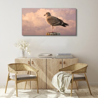 Foto auf leinwand Geflügelter Wächter in den Wolken