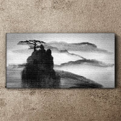 Foto auf leinwand Ein einsamer Baum auf einem felsigen Berg