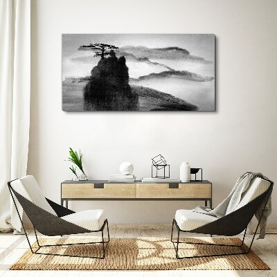 Foto auf leinwand Ein einsamer Baum auf einem felsigen Berg